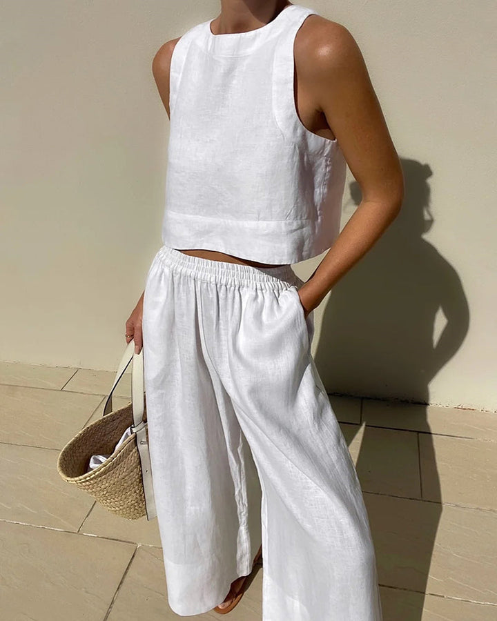 Sleeveless crop top and wide-leg trousers