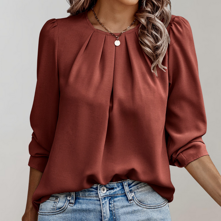 Pleated blouse with puff sleeves