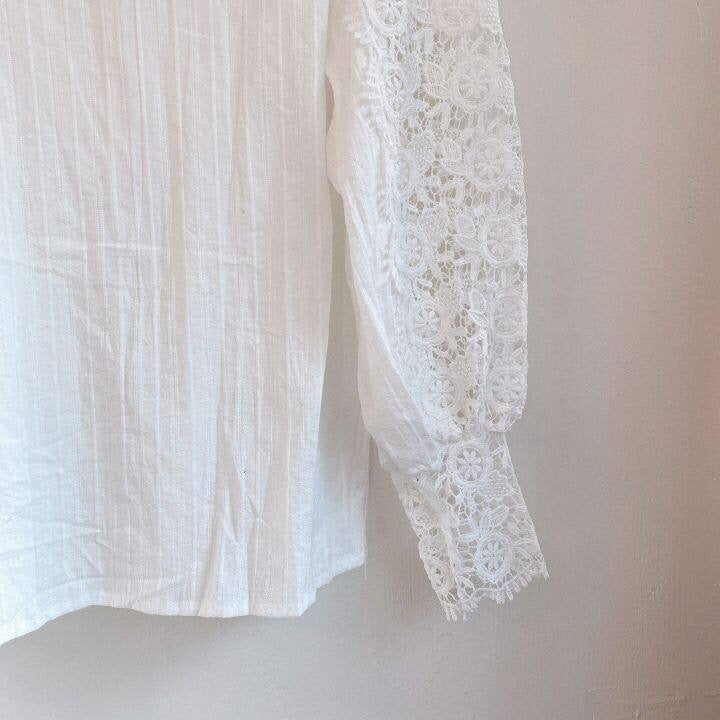 Elegant lace-embroidered tunic blouse