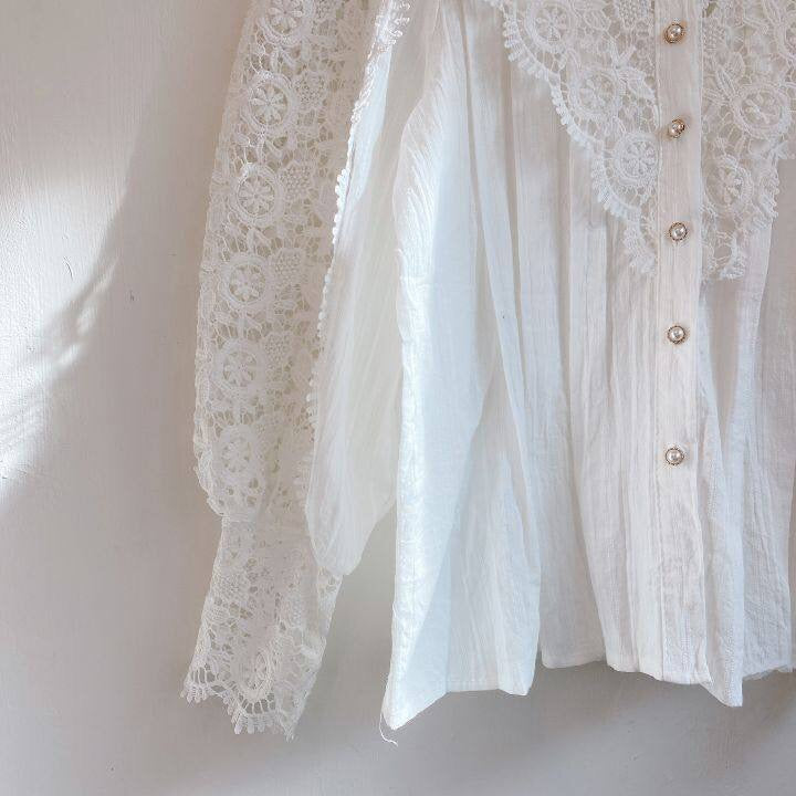 Elegant lace-embroidered tunic blouse