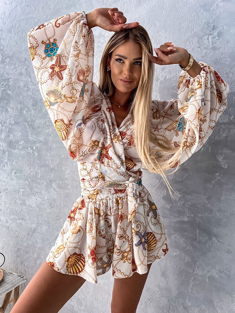 Tropical print playsuit with deep v-neck and wide sleeves