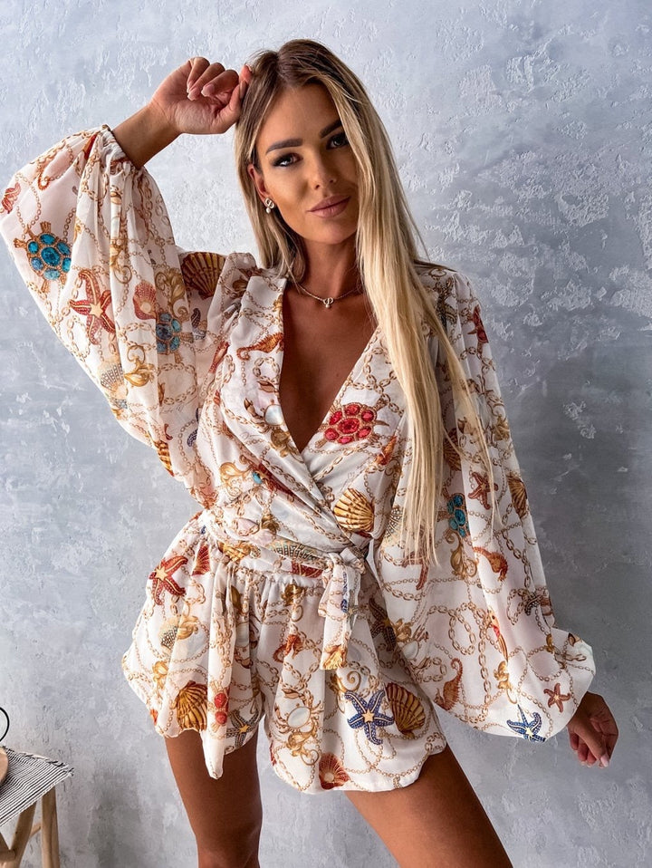 Tropical print playsuit with deep v-neck and wide sleeves