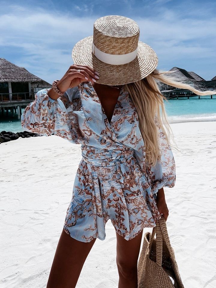 Tropical print playsuit with deep v-neck and wide sleeves