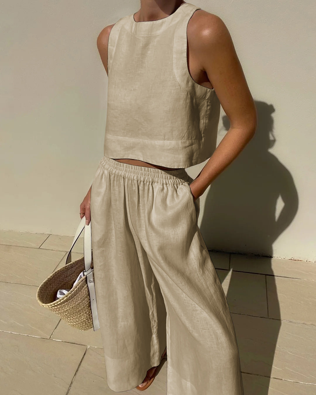 Sleeveless crop top and wide-leg trousers