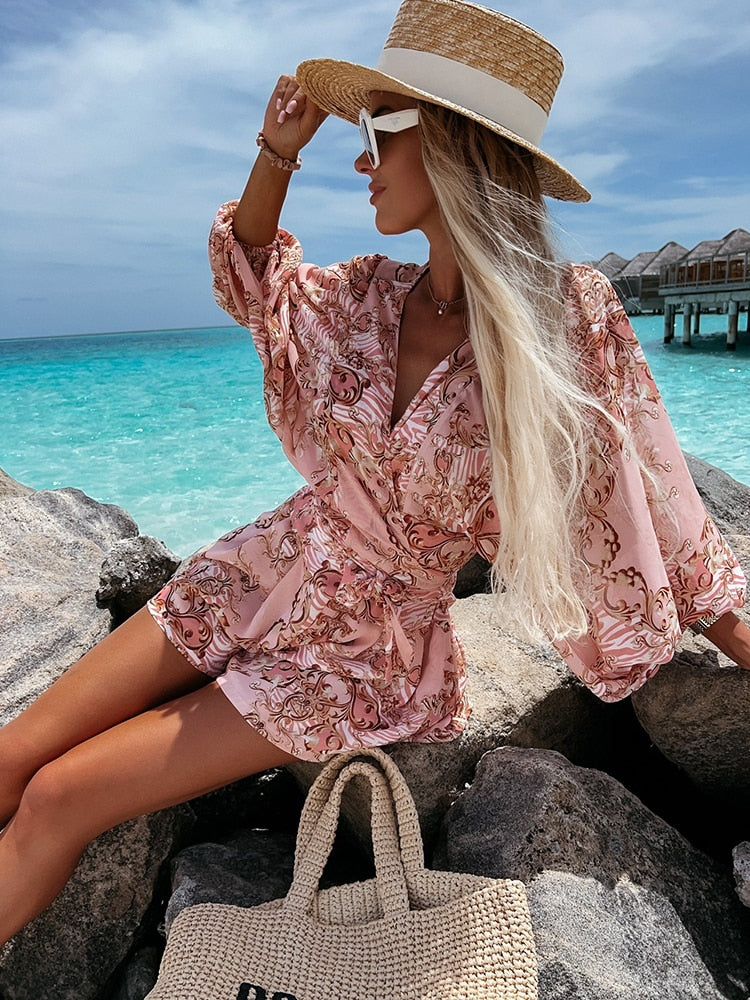 Tropical print playsuit with deep v-neck and wide sleeves