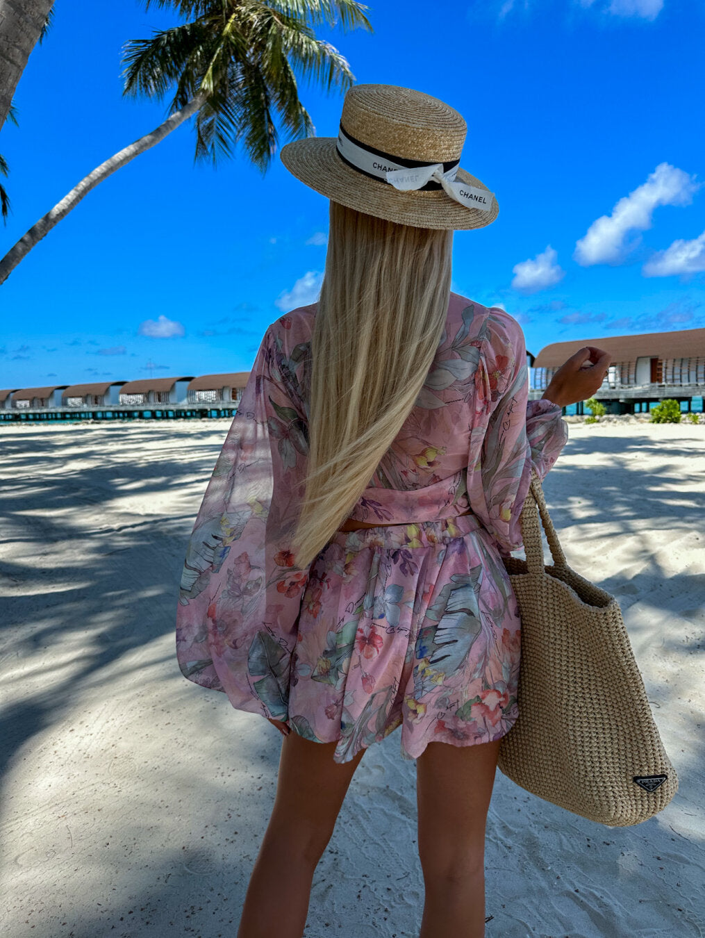 Tropical print playsuit with deep v-neck and wide sleeves