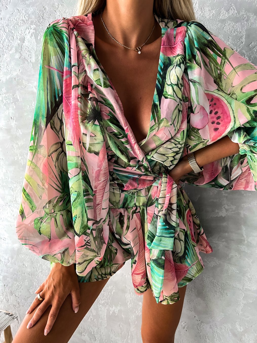 Tropical print playsuit with deep v-neck and wide sleeves